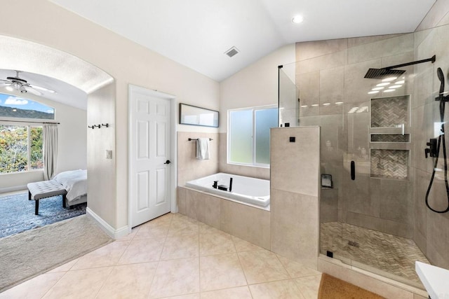 bathroom with shower with separate bathtub, tile patterned flooring, ceiling fan, and vaulted ceiling