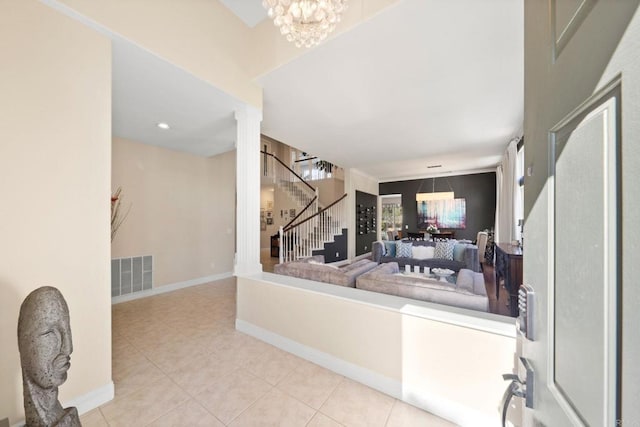 interior space featuring light tile patterned floors and a chandelier