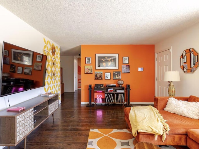 living room featuring a textured ceiling and dark wood-type flooring