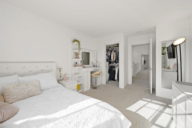 carpeted bedroom featuring a closet