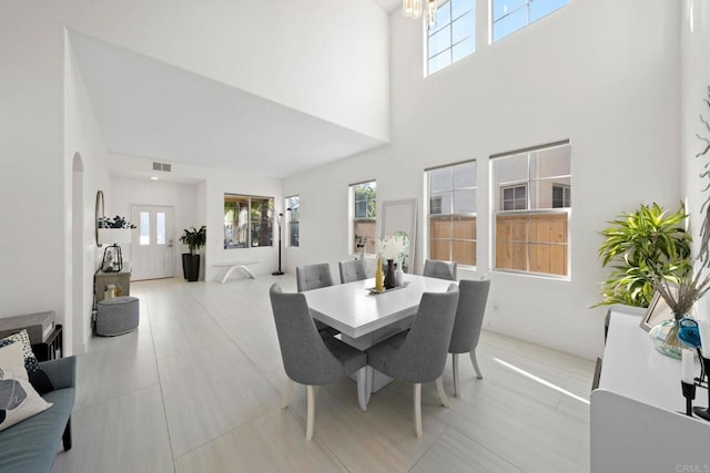 dining room featuring a high ceiling