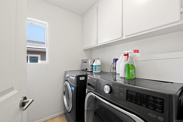 laundry area featuring cabinets and independent washer and dryer