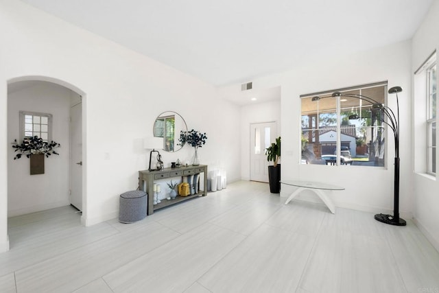 hallway featuring light tile patterned floors