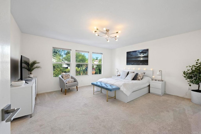 carpeted bedroom featuring a chandelier