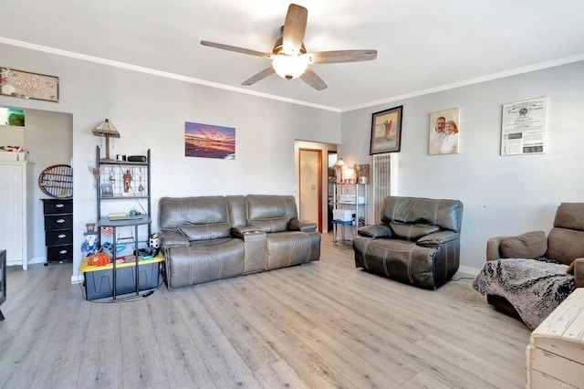 living room with ceiling fan, ornamental molding, and light wood-type flooring