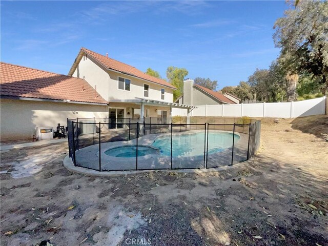 view of swimming pool featuring a patio, an in ground hot tub, and a pergola