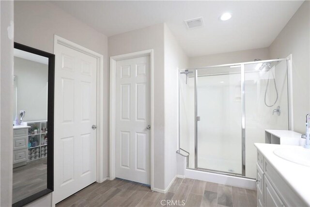 bathroom with vanity and walk in shower