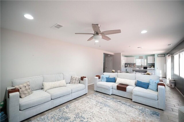 living room with ceiling fan