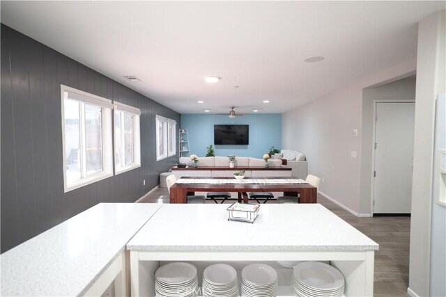 kitchen featuring hardwood / wood-style flooring and ceiling fan