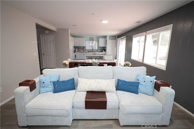 living room featuring baseboards