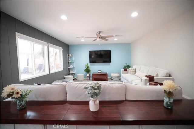 living room with visible vents, a ceiling fan, and recessed lighting