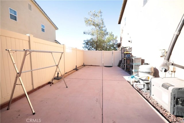 view of patio featuring fence
