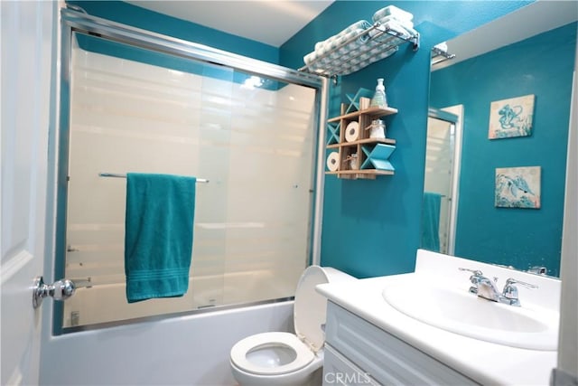 full bath with toilet, enclosed tub / shower combo, and vanity