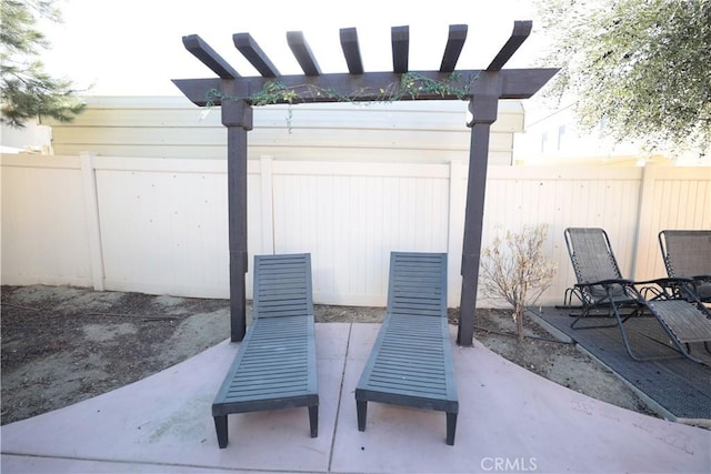 view of patio with a pergola and a fenced backyard