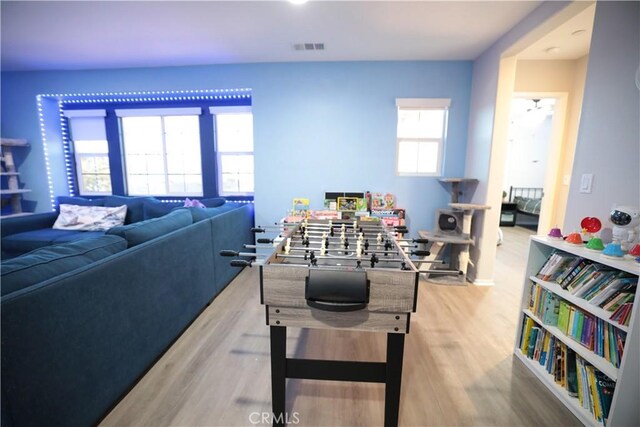 recreation room with visible vents and wood finished floors
