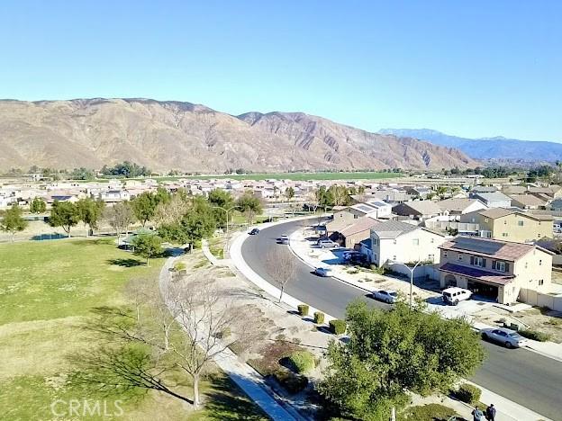 birds eye view of property with a mountain view and a residential view