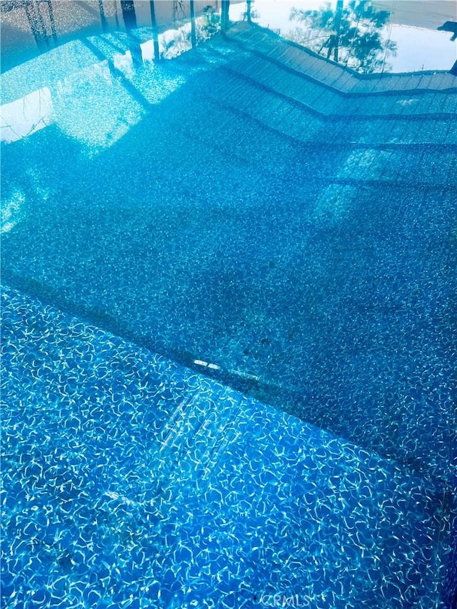 view of swimming pool featuring a swimming pool