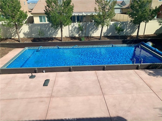 view of pool with a fenced in pool and a fenced backyard