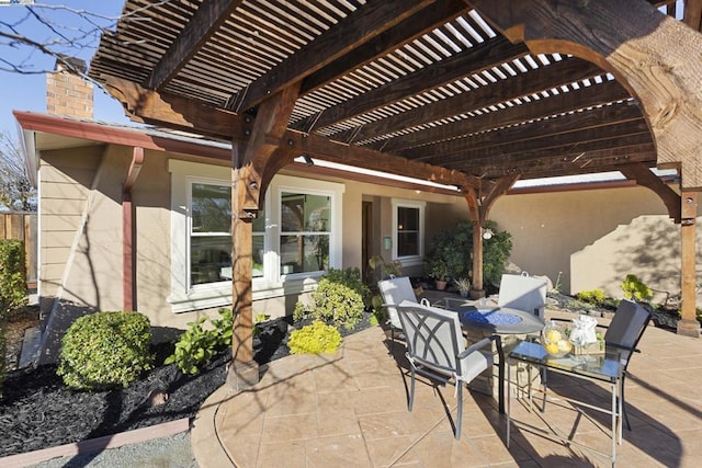 view of patio featuring a pergola