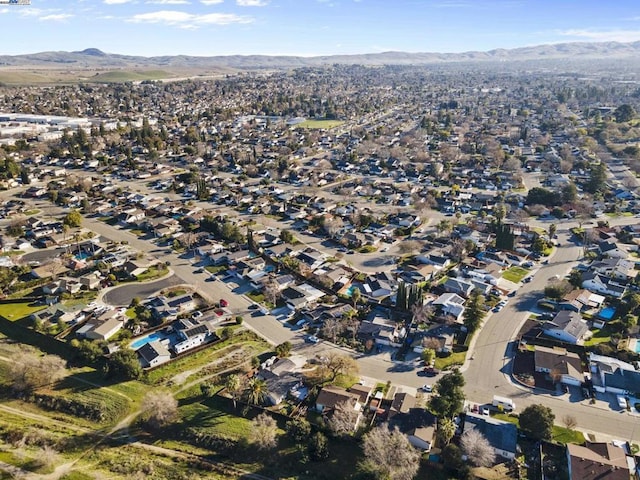 birds eye view of property with a mountain view