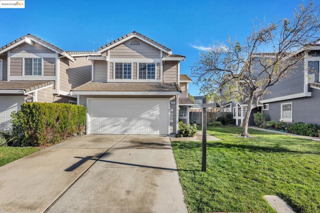 view of front of house with a front lawn and a garage