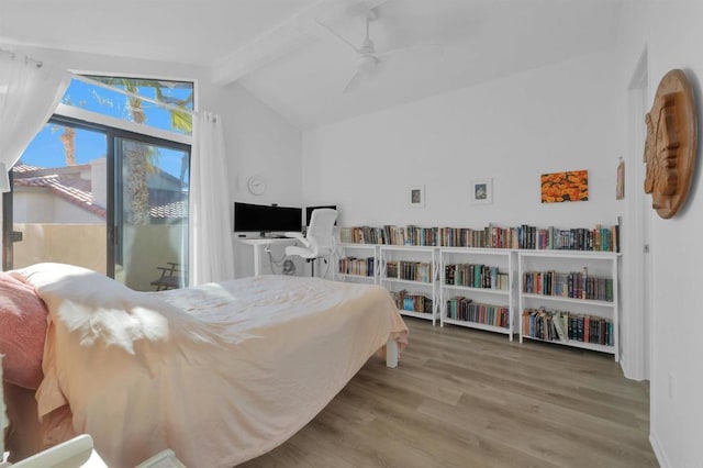 bedroom with ceiling fan, hardwood / wood-style floors, and vaulted ceiling with beams