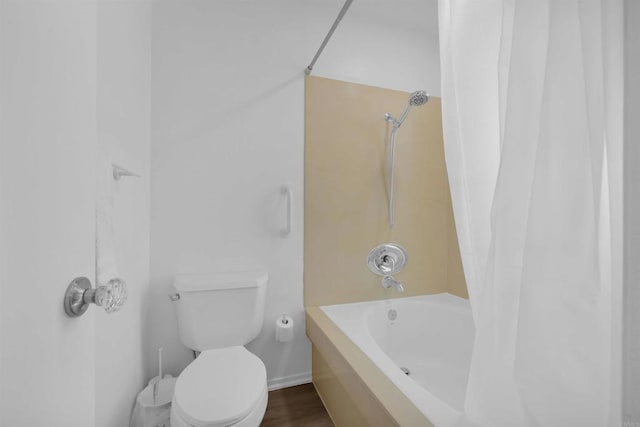 bathroom featuring toilet, shower / bath combo, and hardwood / wood-style flooring