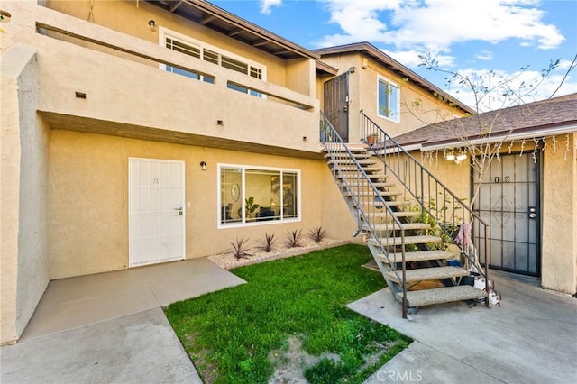 entrance to property with a patio