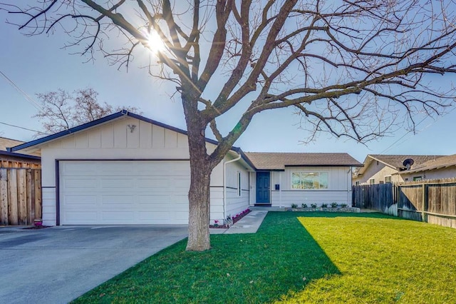 ranch-style home featuring a front yard and a garage