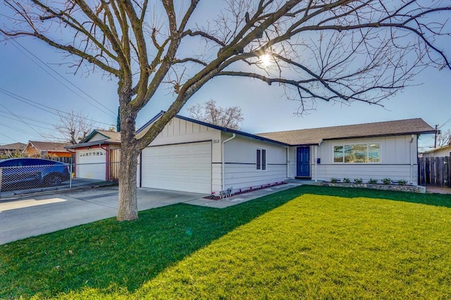 single story home with a front yard and a garage