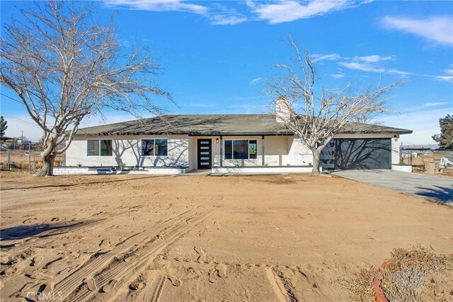 single story home featuring a garage