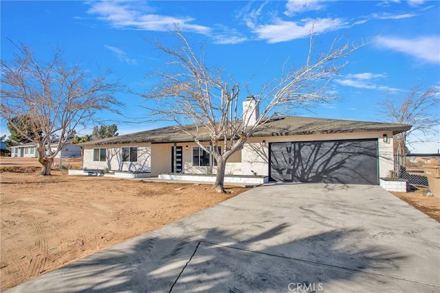 single story home with a garage