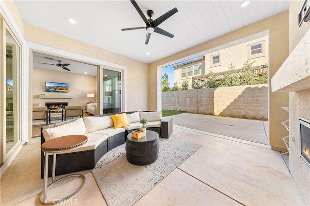 view of patio with ceiling fan and outdoor lounge area