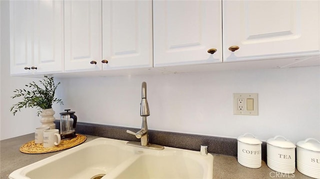 room details with sink and white cabinets