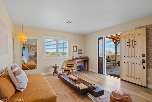 1388 Fortuna Ave, Landers, CA 92285 - living area featuring plenty of natural light and light wood-type flooring