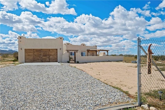 southwest-style home featuring a garage