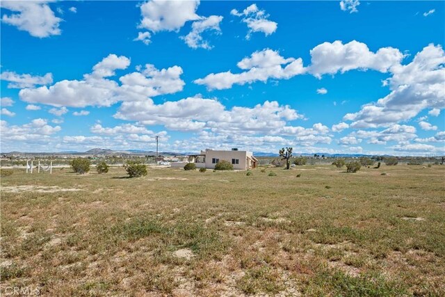 view of yard with a rural view