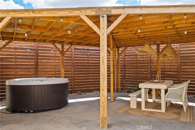 view of patio / terrace featuring a hot tub