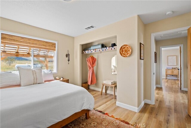 bedroom with light wood-type flooring