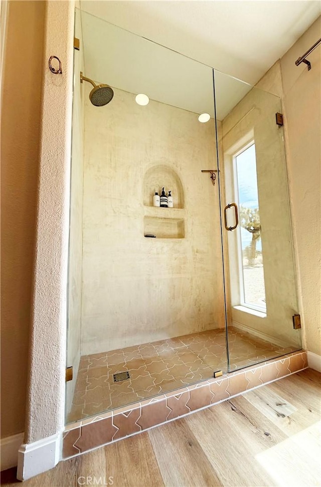 1388 Fortuna Ave, Landers, CA 92285 - full bathroom featuring a stall shower and wood finished floors