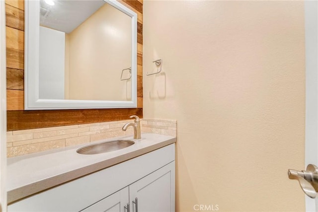 bathroom with vanity and backsplash