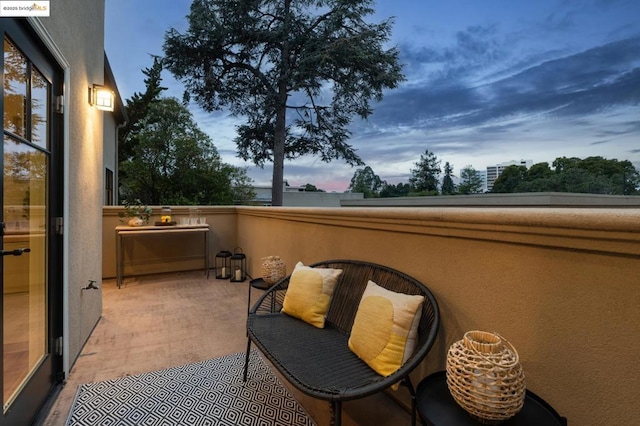 view of balcony at dusk