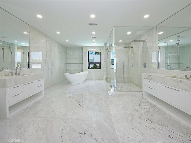 bathroom featuring independent shower and bath and vanity