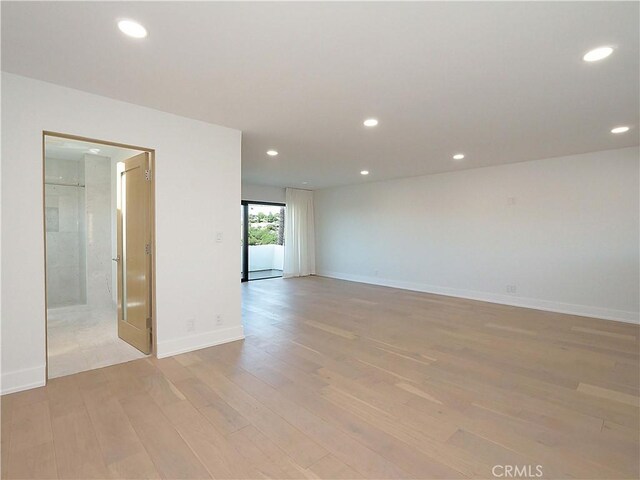 spare room featuring light hardwood / wood-style flooring