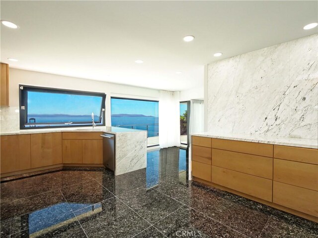 kitchen with stainless steel dishwasher and sink