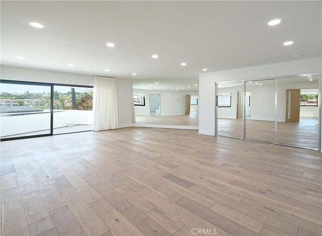 unfurnished living room featuring light hardwood / wood-style floors