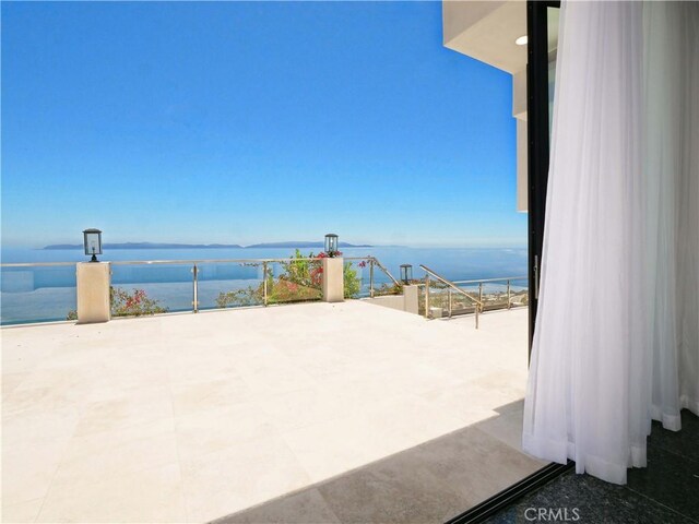 view of patio / terrace featuring a water view