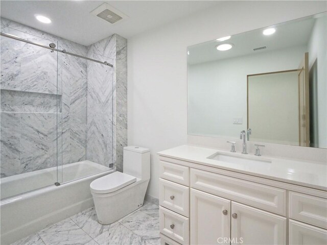 full bathroom with toilet, enclosed tub / shower combo, and vanity