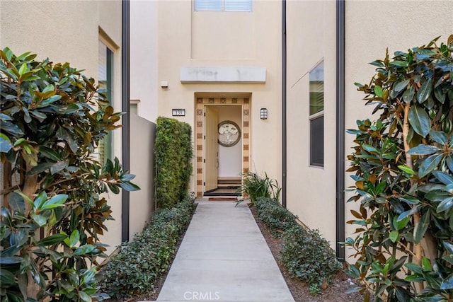 doorway to property with stucco siding