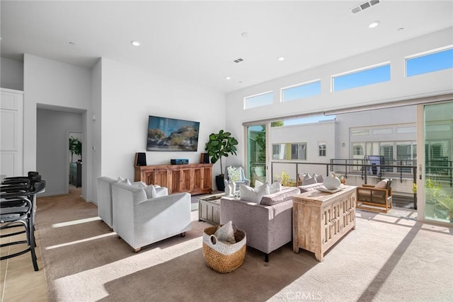 living room featuring a high ceiling